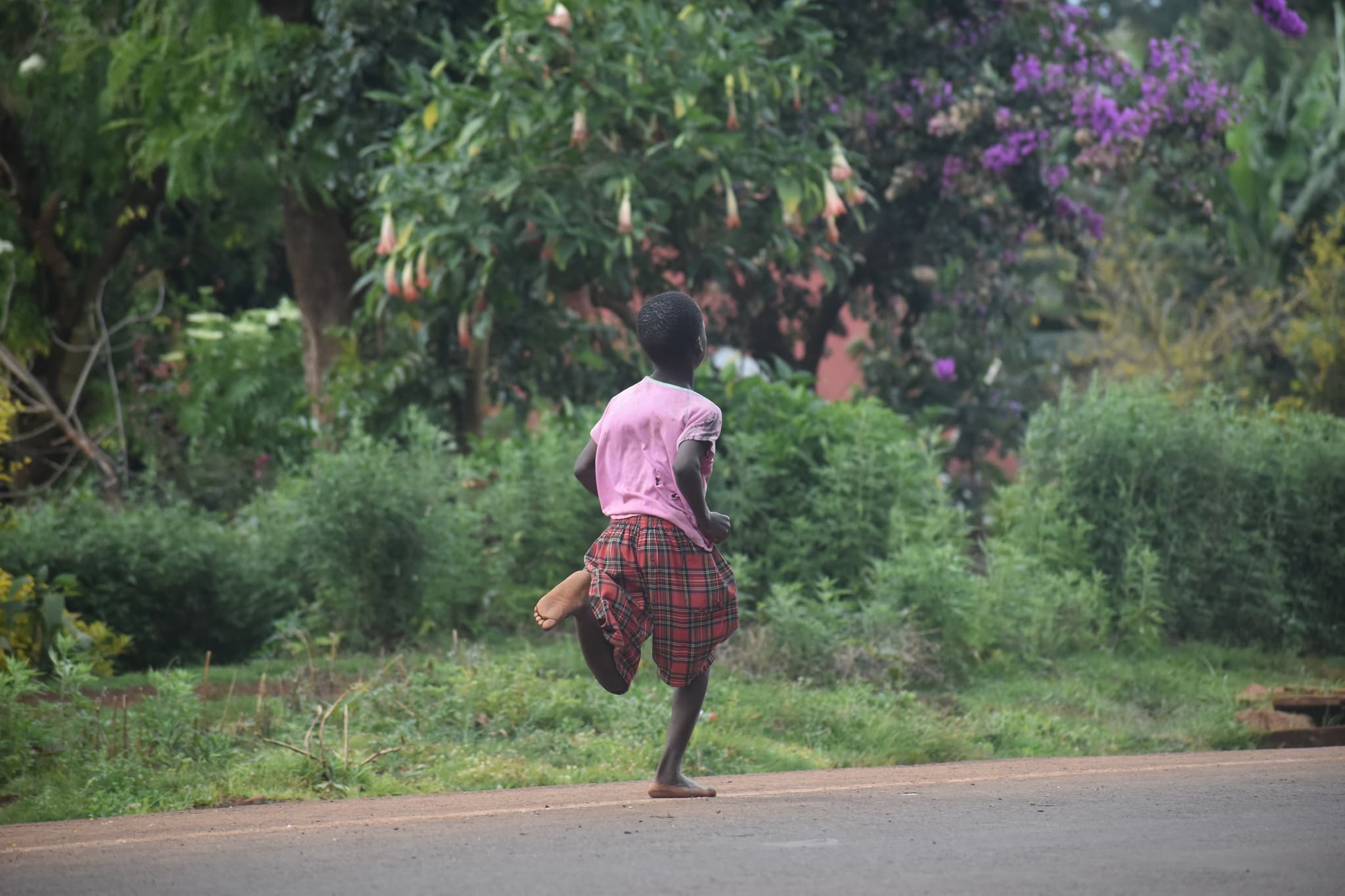 All champions start on barefoot. Photo taken by Kapchorwa-native Collins Cheshewa during a Run Kapchorwa Community event in October 2022 on the newly tarmaced Kapchora-Teryet road-1773395083675.JPG